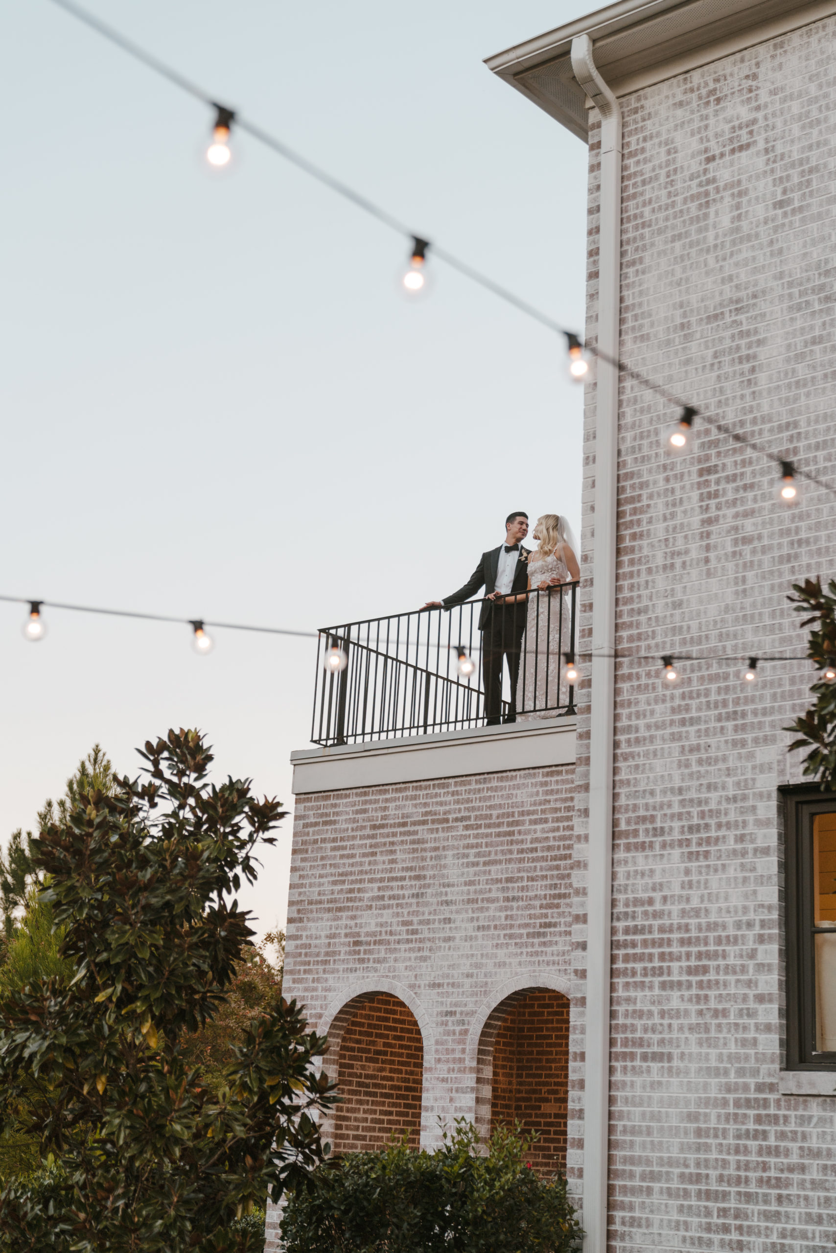 bride and groom on balcony